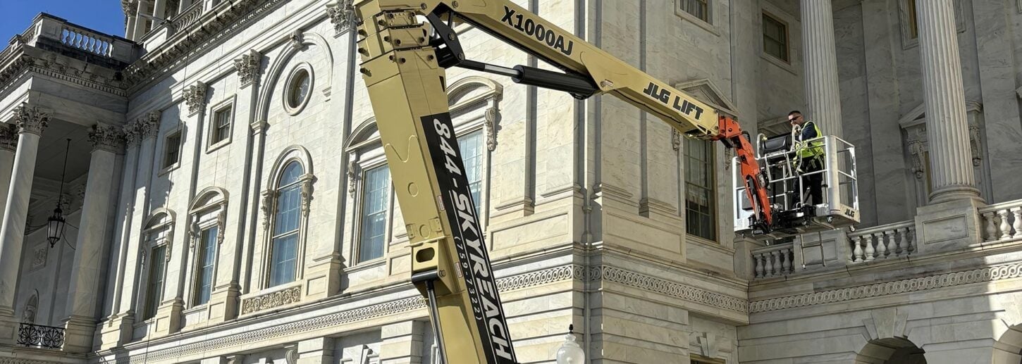 Skyreach JLG boom lift with technicians working on stonework at the U.S. Capitol building